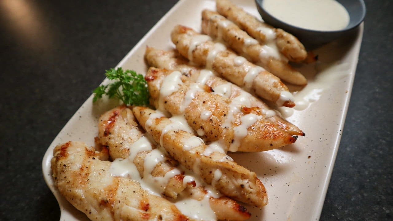 image of chicken tenders on a plate with ranch dressing
