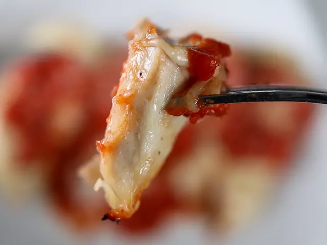 Bite of grilled chicken parmesan