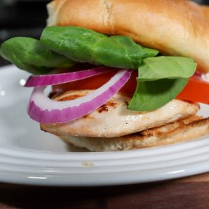 healthy grilled chicken sandwich sitting on a plate