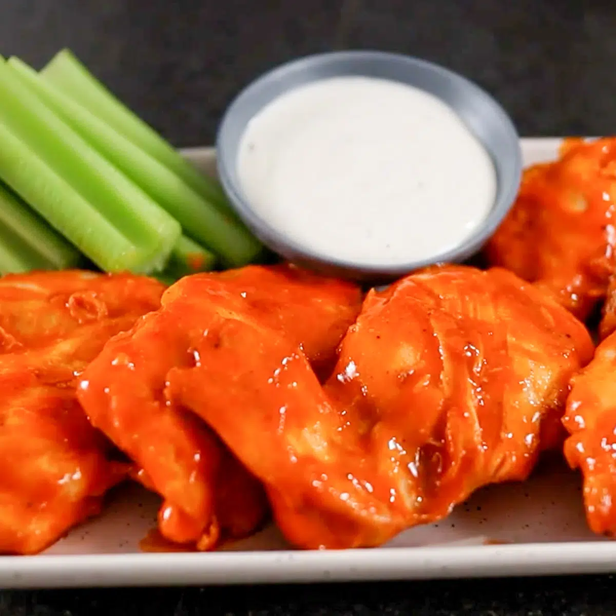 buffalo chicken thighs on a plate
