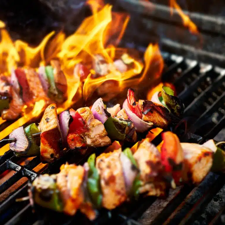 What is the Difference Between Grilling and Barbecuing Chicken?